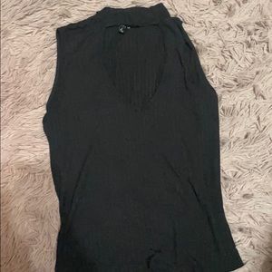 Black blouse with open cut at front.